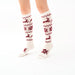 White and red nordic reindeer knee highs